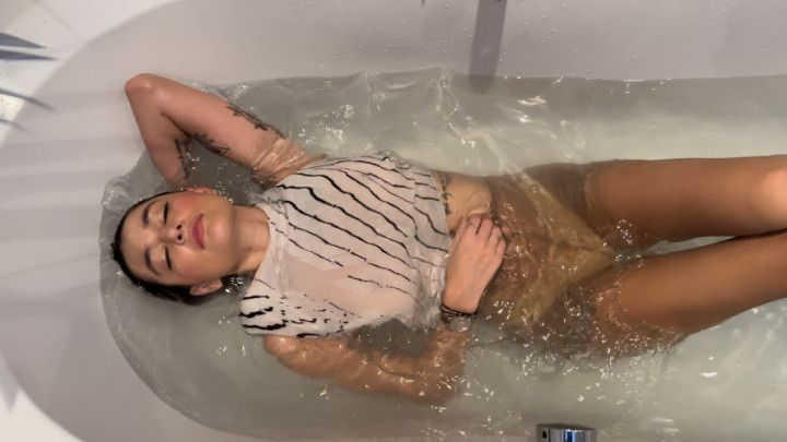 Sammi Perri warms up with a sexy fully clothed bath