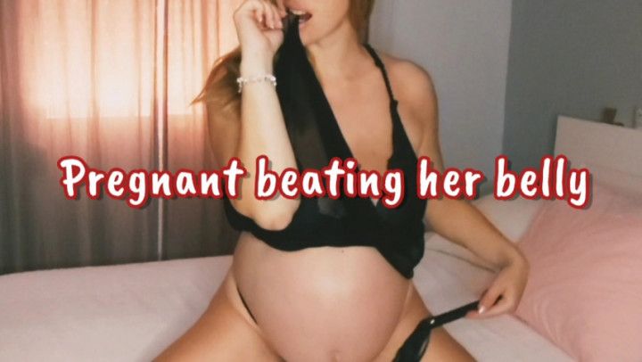 Pregnant spanking her belly and masturbating