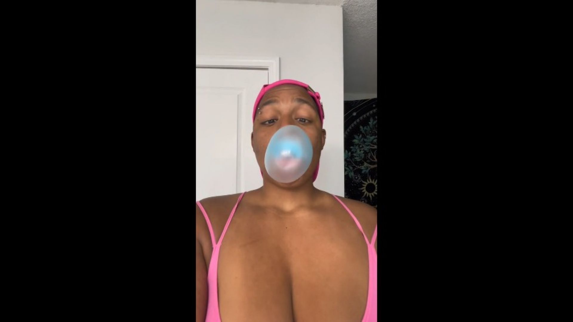 Bubblegum Babe With Pierced Nipples Blowing Bubbles