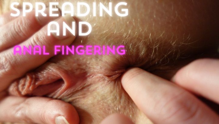 Spreading and anal fingering closeup