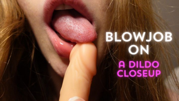Blowjob on a dildo closeup