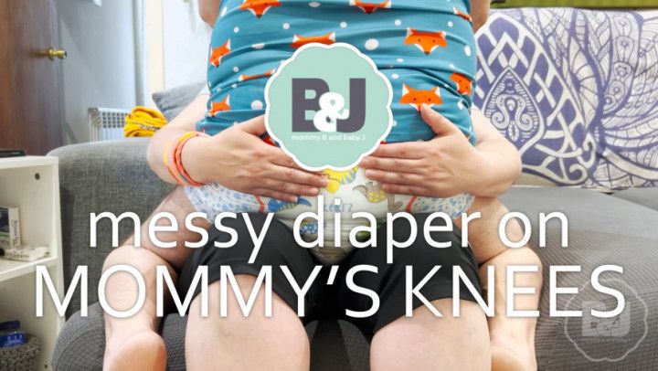 Messy diaper on mommy's knees