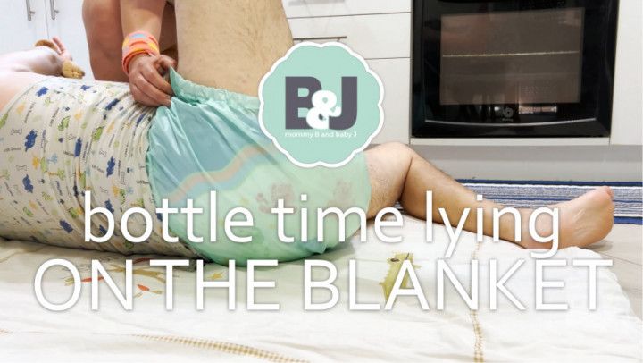 Bottle time lying on the blanket