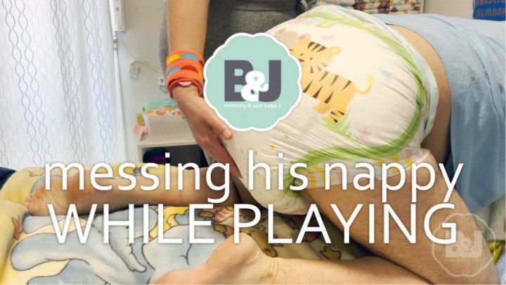 Messing his nappy while playing