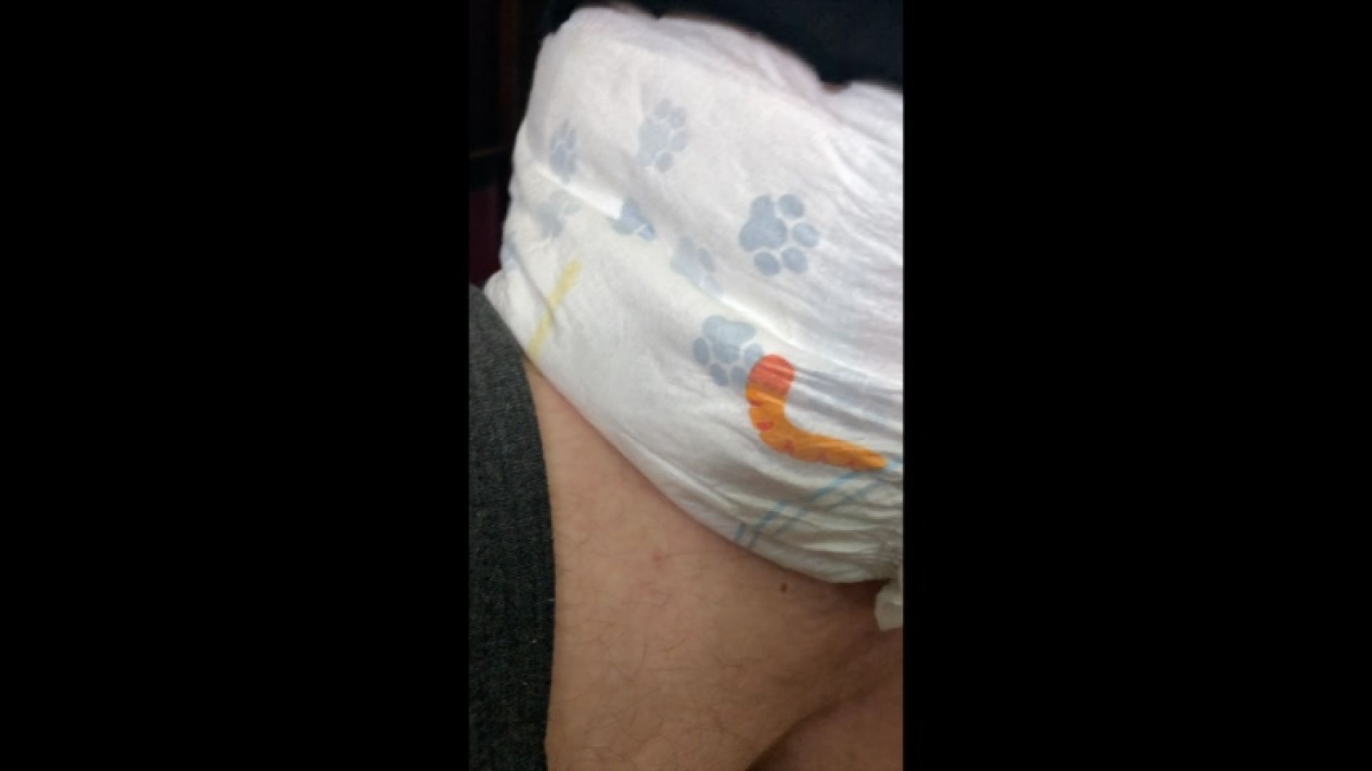 Using a cute diaper then Daddy bounces me on his knee