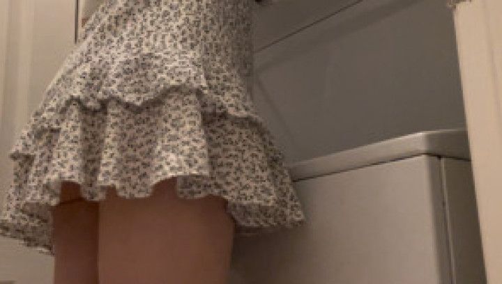 Doing laundry in a tiny dress