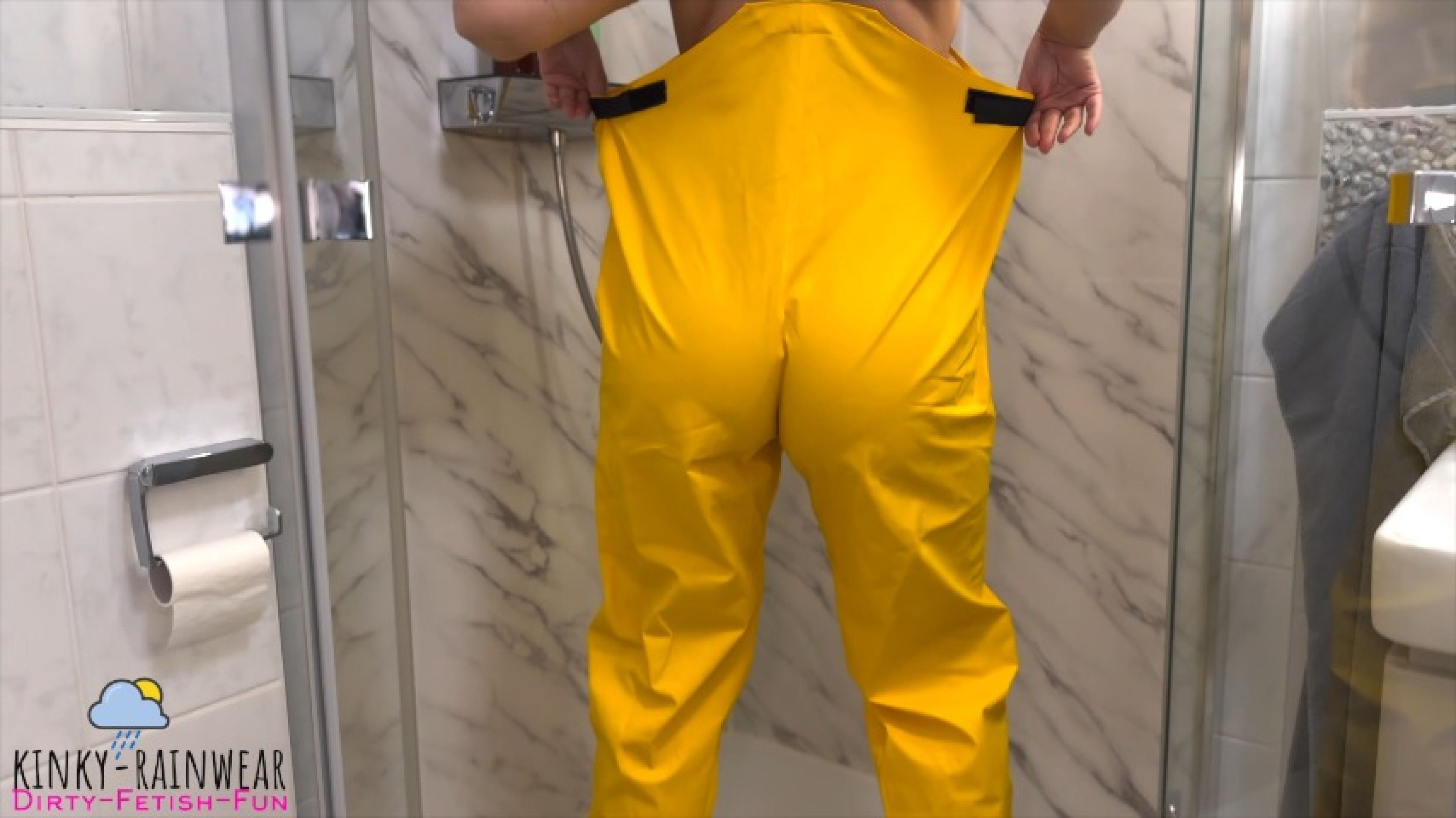 curvy chick in yellow rubber pants shower play