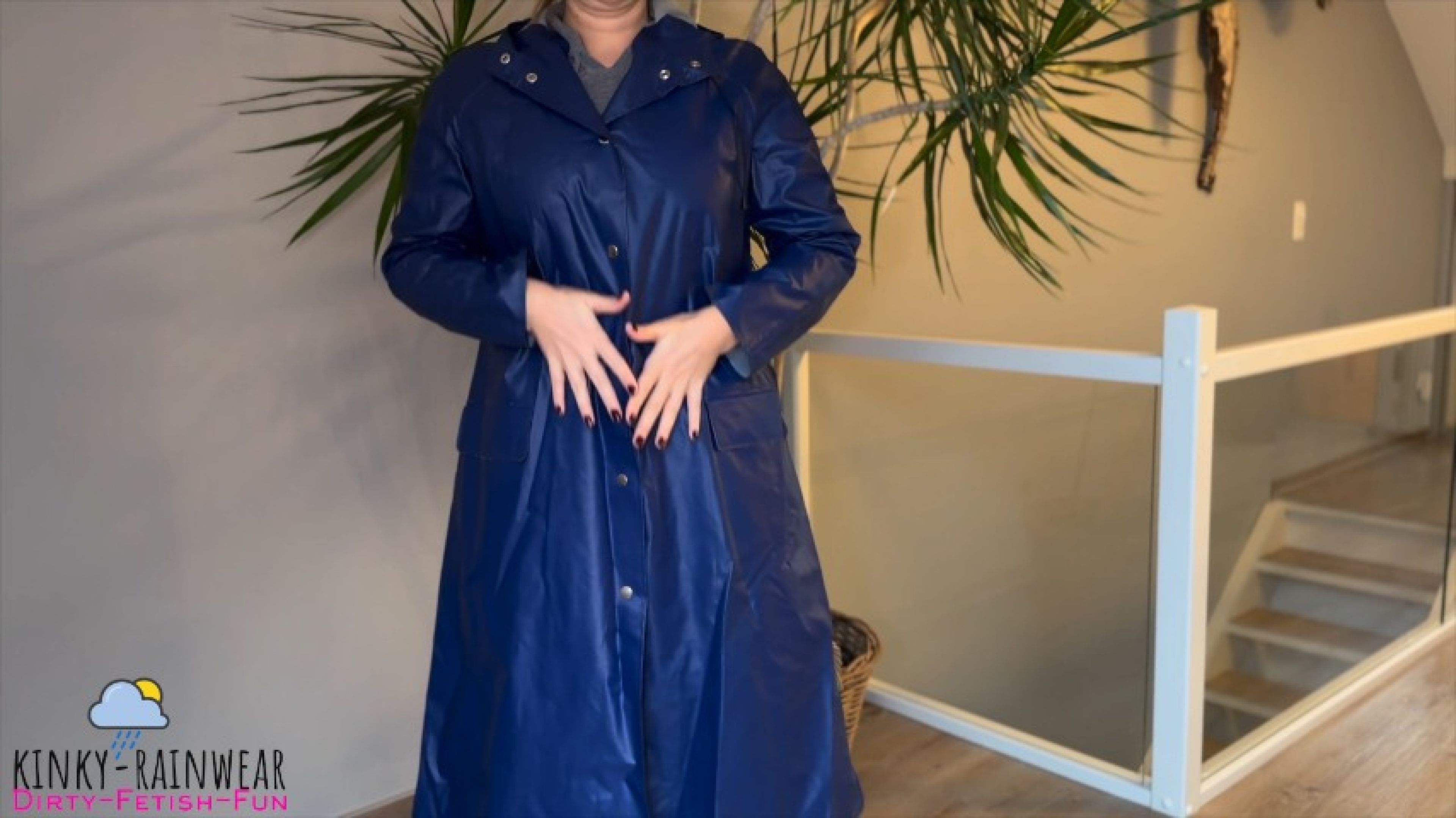 curvy lady in blue rubber rain coat posing and upskirt