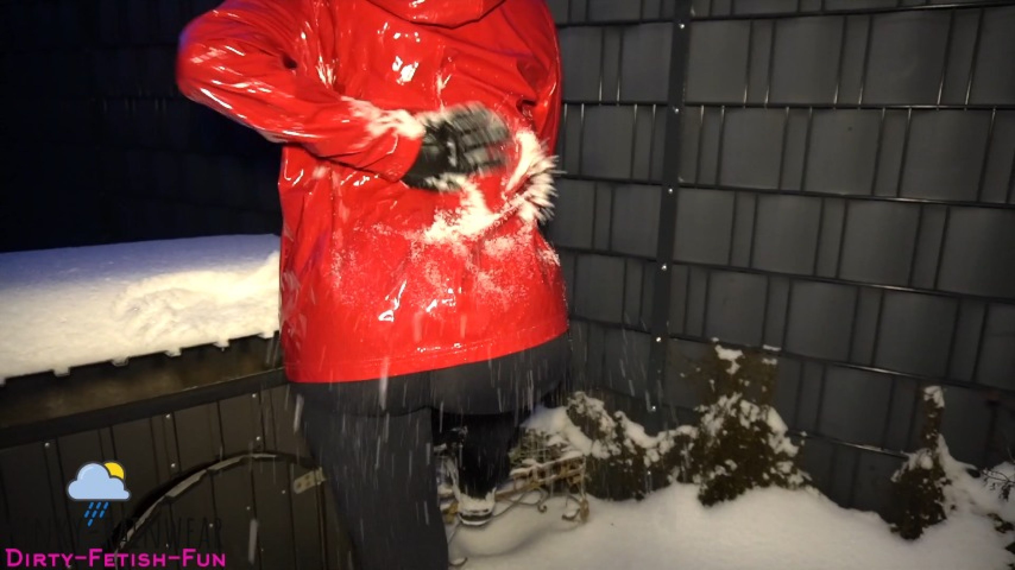 naughty girl in red rain jacket playing in the snow