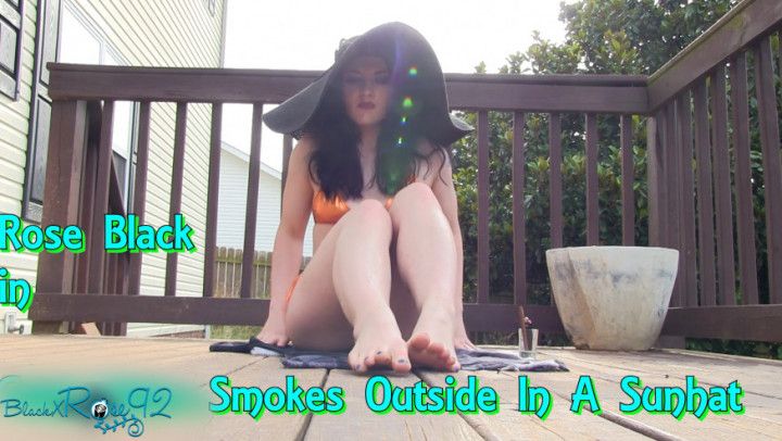 Goth Babe Smokes Outside In A Sunhat