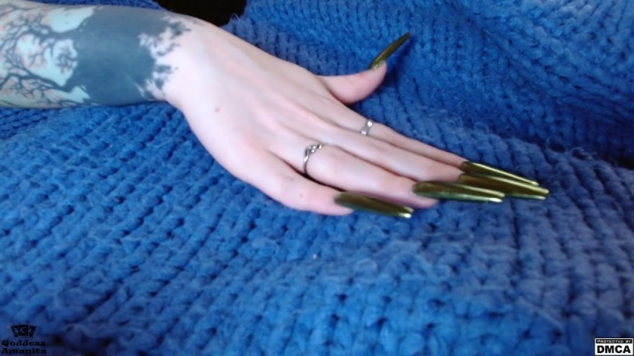 Long nails and wool sweater mesmerize