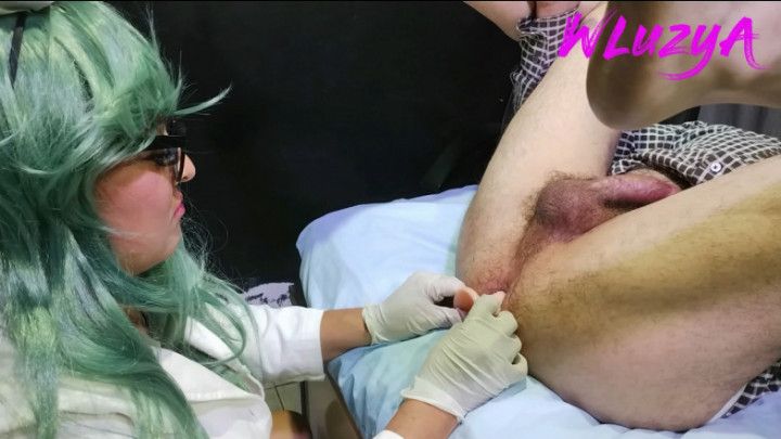 doctor performs anal exam with long dildo