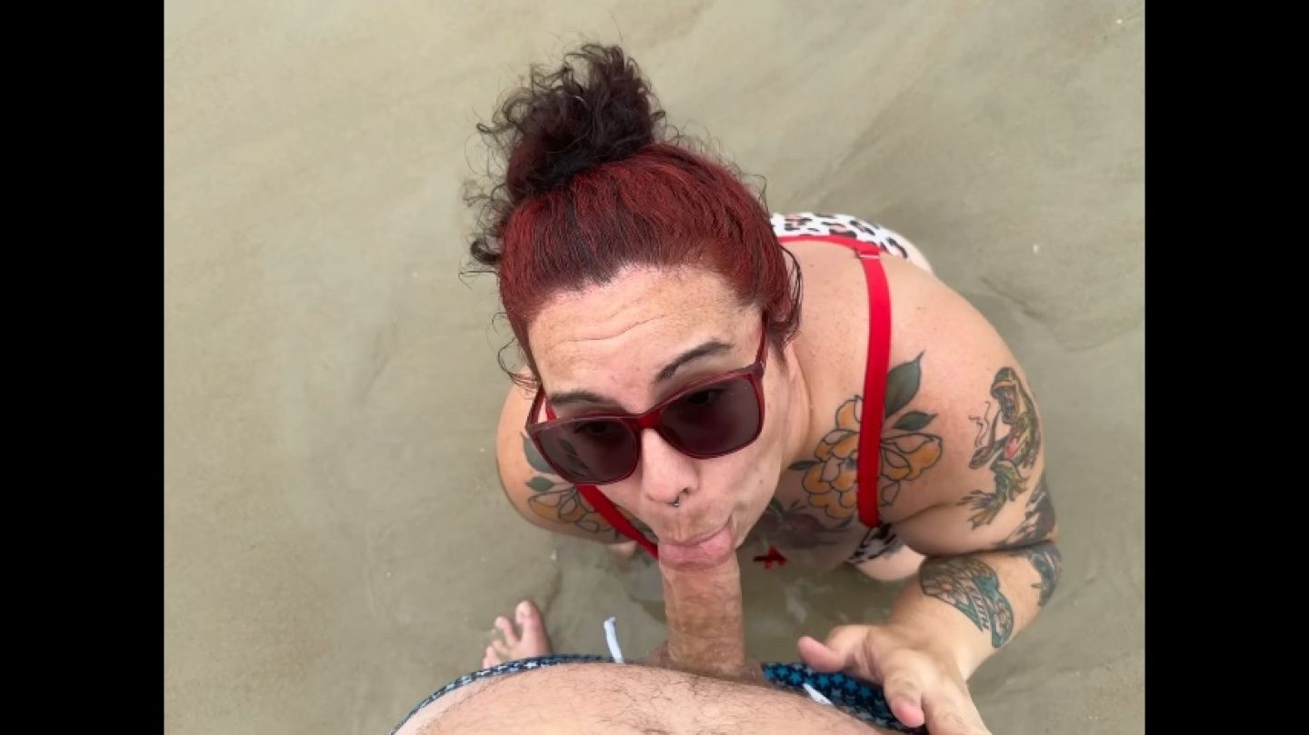 MILF gives blow job on the beach and gets cum shot on tits