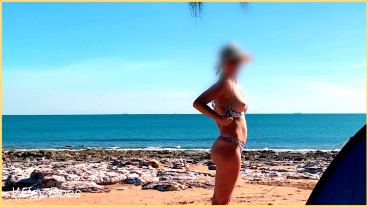 WIfe exposes tits in a hot bikini on public beach