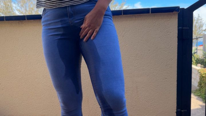 Desperate outdoor pee in blue jeans