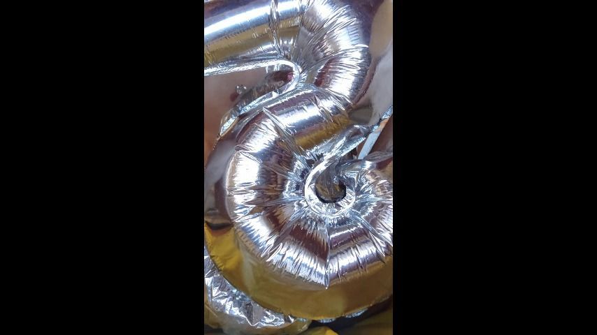 Looner Playing with Metallic Balloons [vertical video