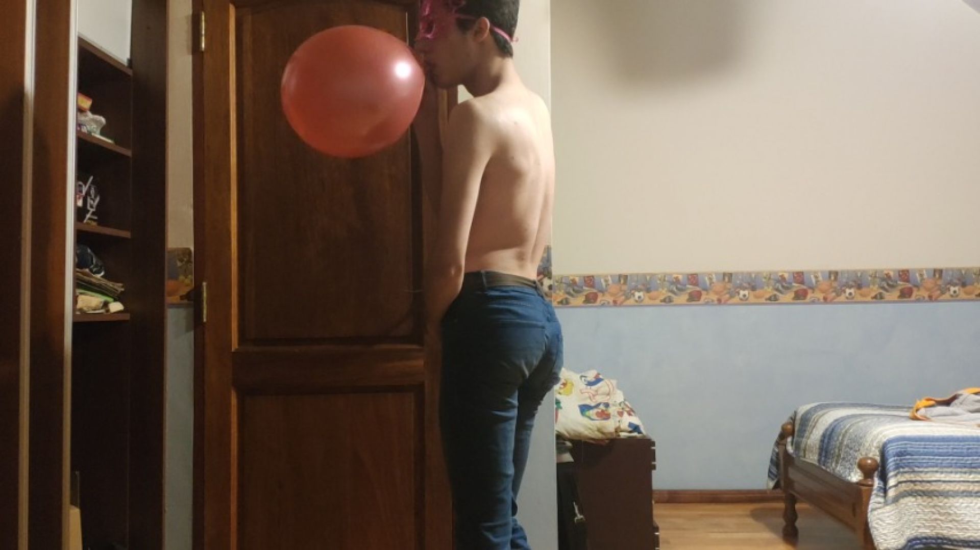 Looner Blowing Up a Red Balloon in Tight Jeans