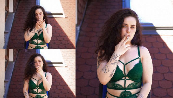 Smoking a cigarette on the roof in my green lingerie