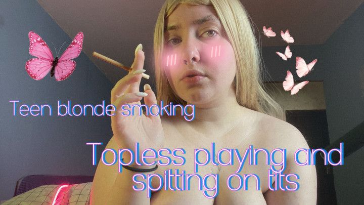 Teen blonde smoking topless, playing and spitting on tits