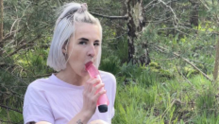 Petite blonde fucking herself with pink dildo in public