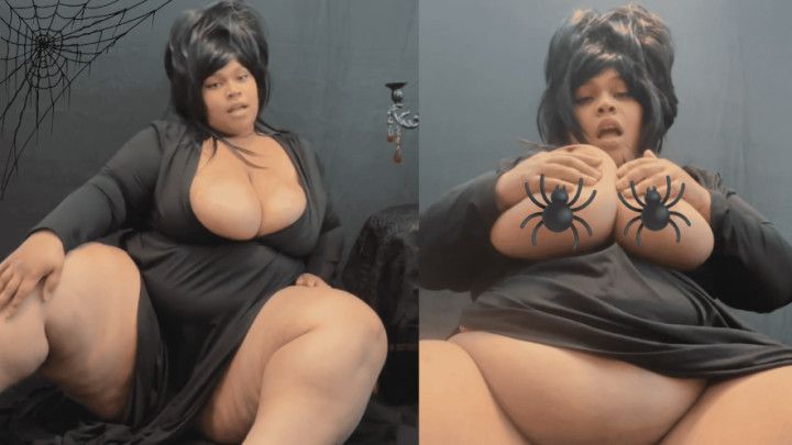 Elvira Revealing Huge Breasts and Rubbing Pussy