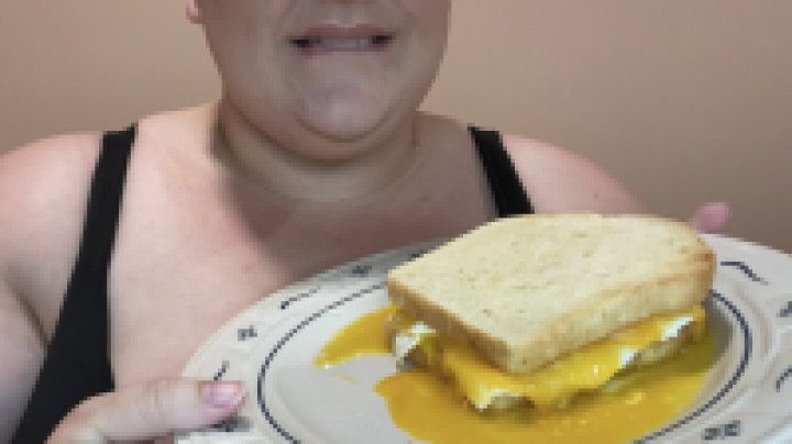 Fatty Eating Runny Egg Sandwich