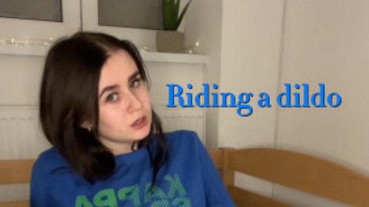 Riding a dildo