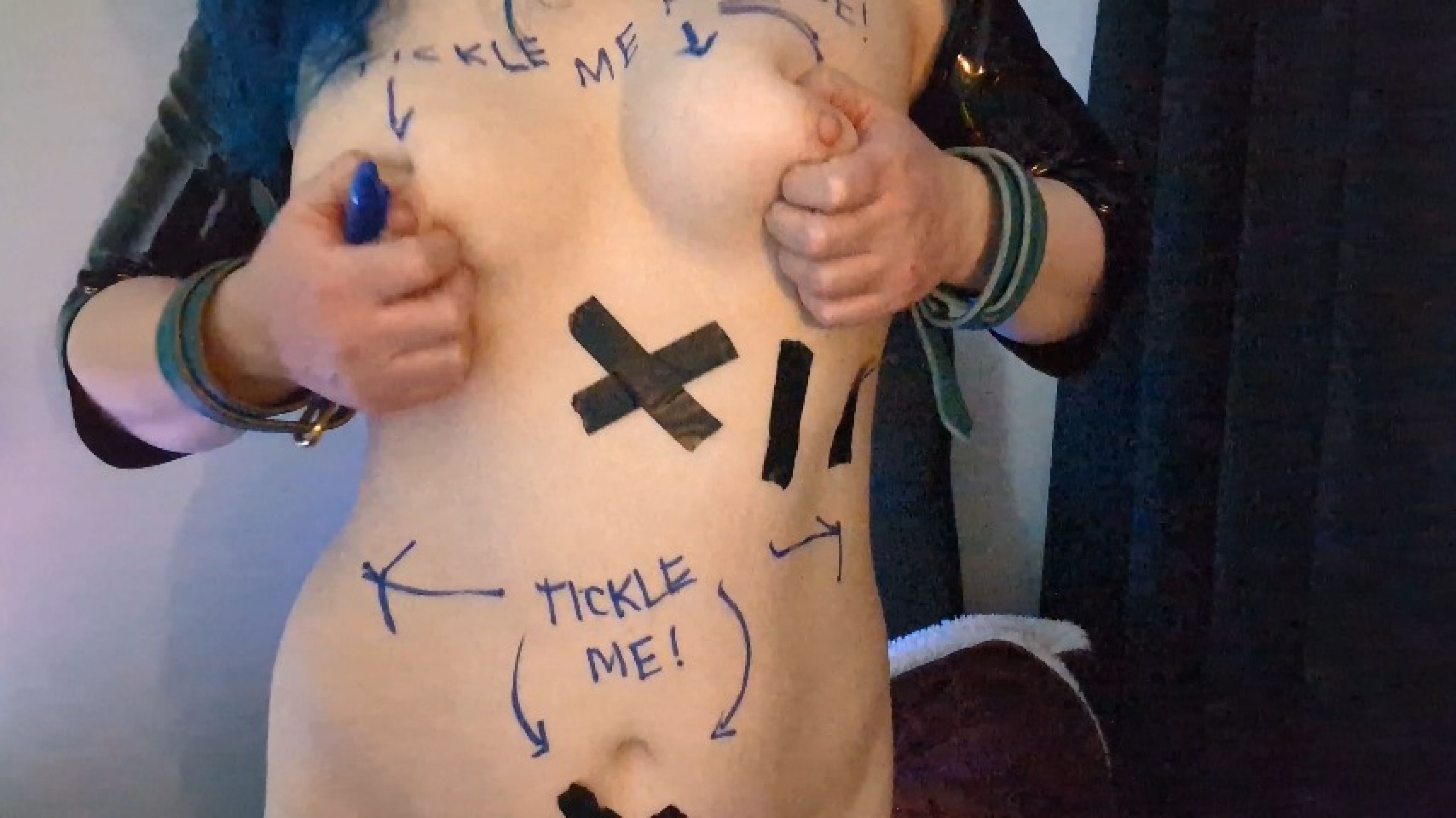 Tickling my tits with writing all over me