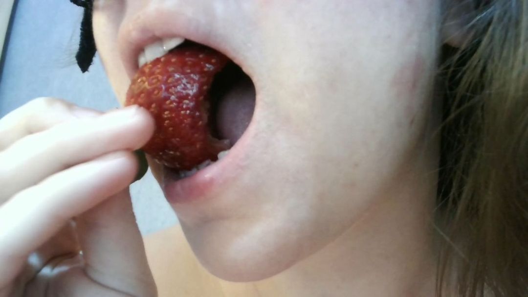 eating sweet strawberries
