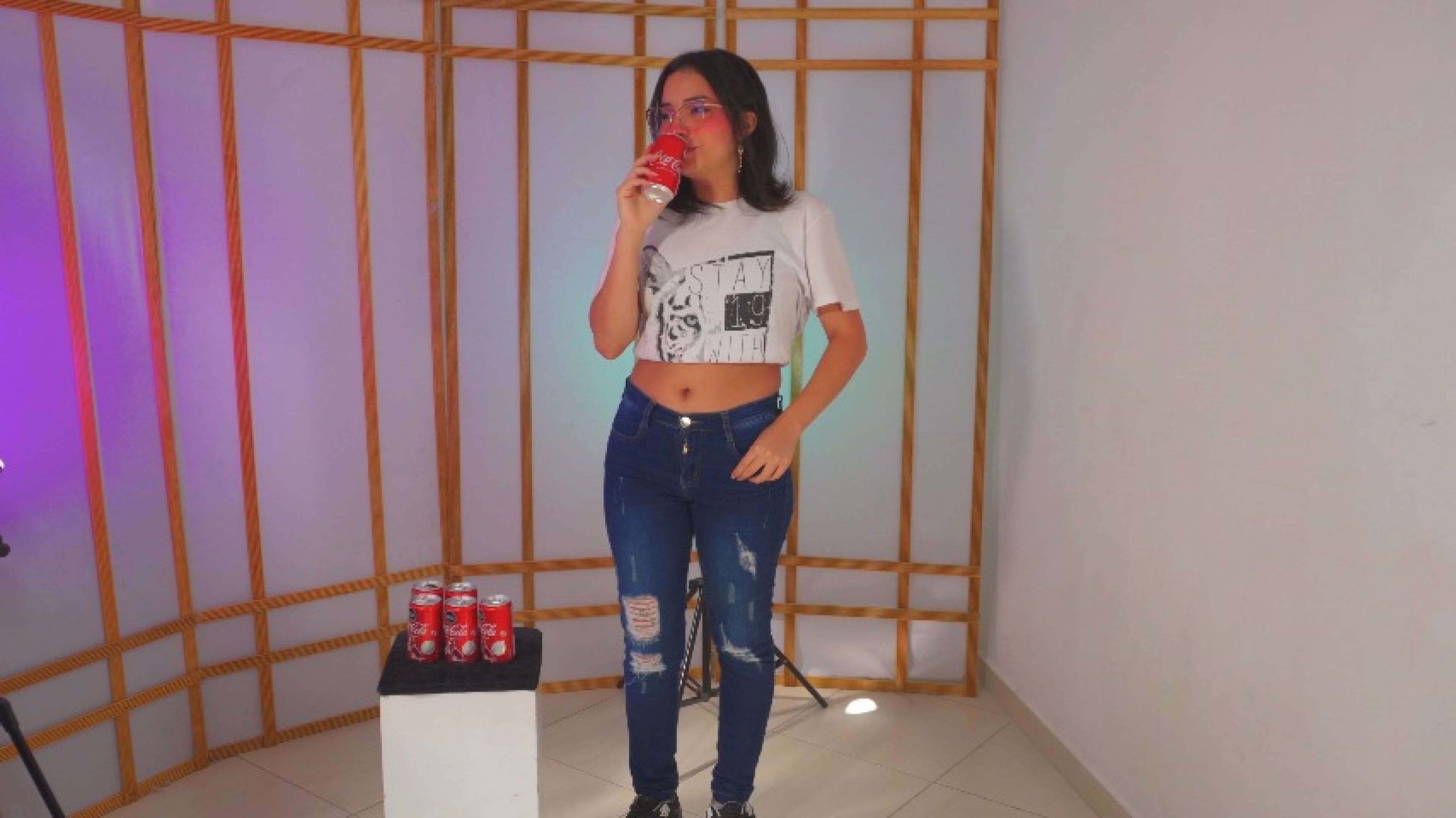 Teen in jeans burping Cola