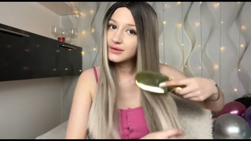 Playing with hair and sucking dildo