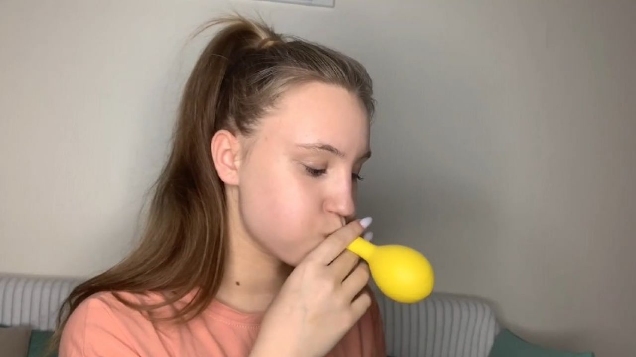 blowing a balloons