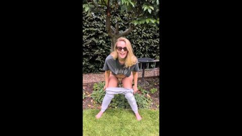 Hot MILF flashes and takes a pee in the garden