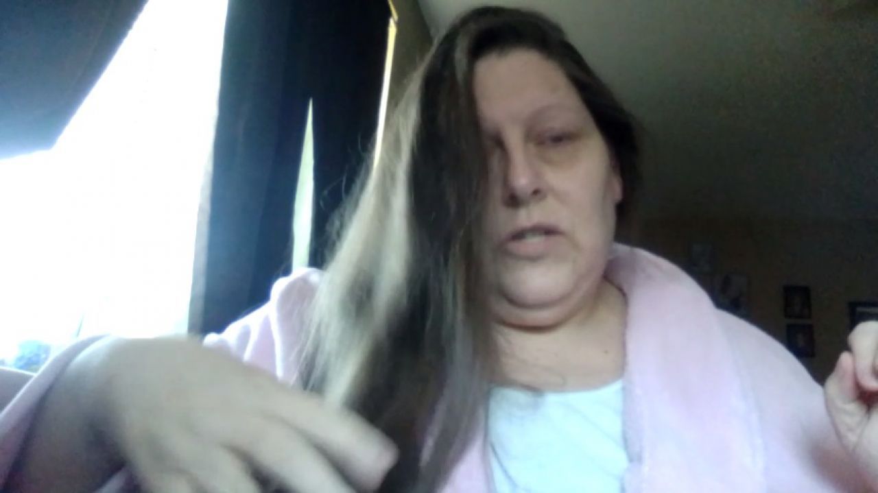 Combing out my hair and putting in leave-in conditioner