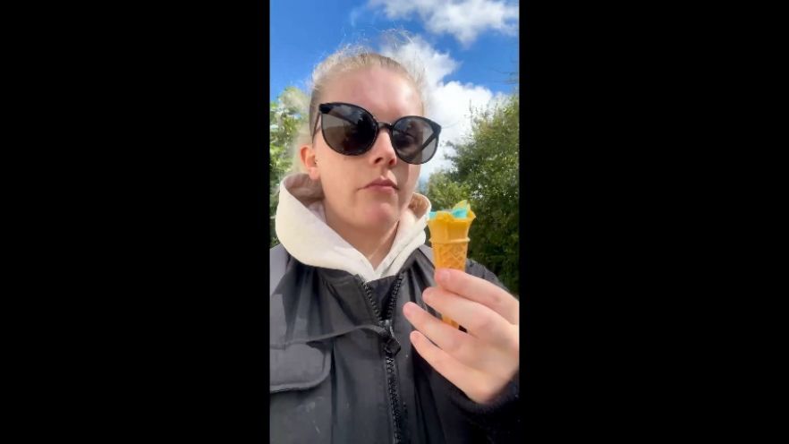 Eating &amp; licking a bubblegum ice cream outdoors clip/teaser