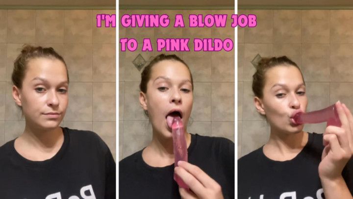 I'm giving a blow job to a pink dildo