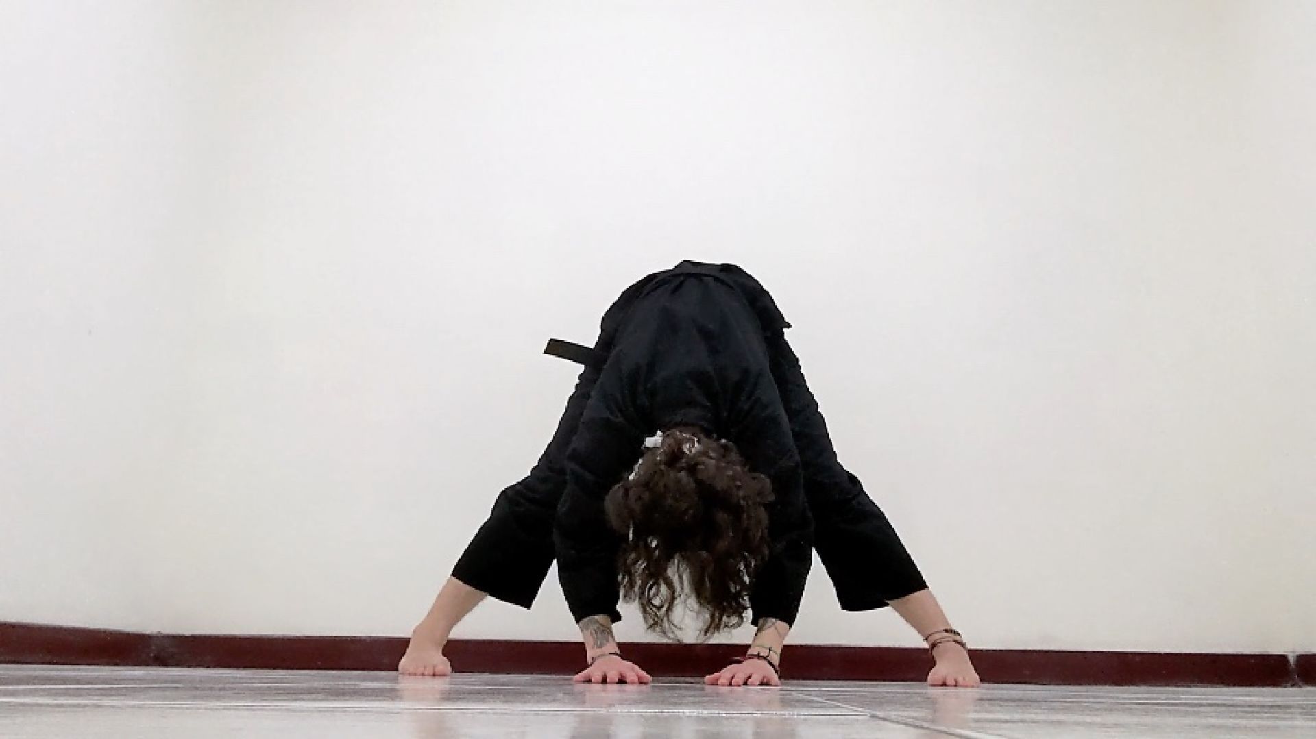 Stretching wearing a black dobok