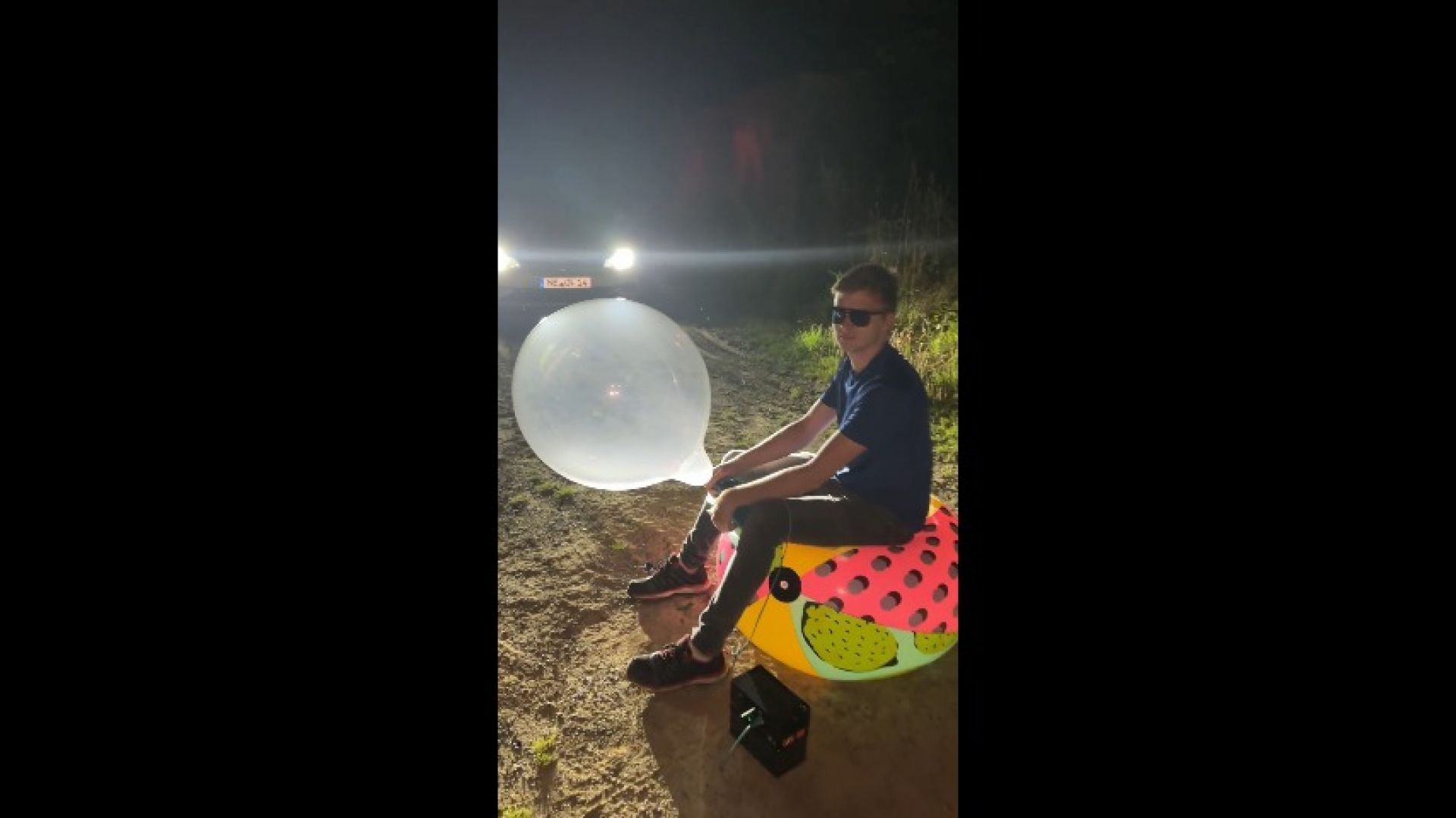 Lukas Sit on a Beachball and Pop much Balloons