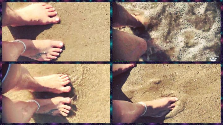 Feet in the sand and sea