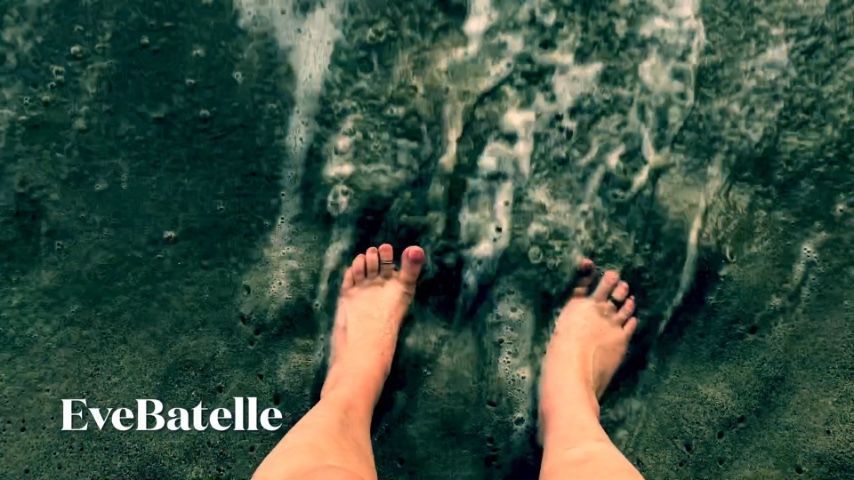 Bare Feet Squishing Toes In The Sand