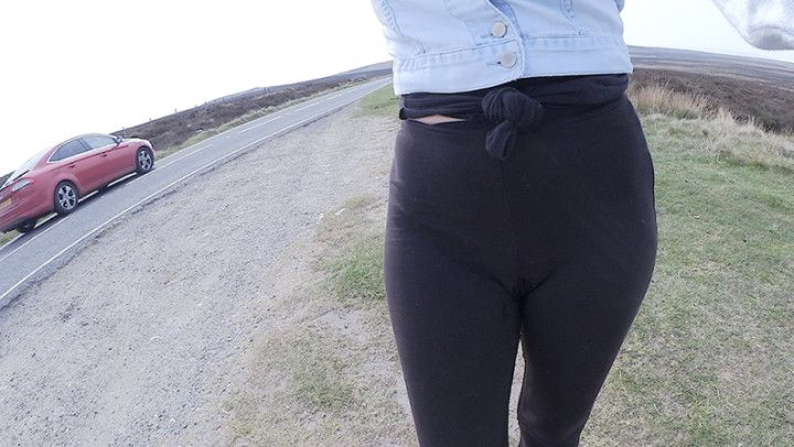 Black leggings peeing in the road