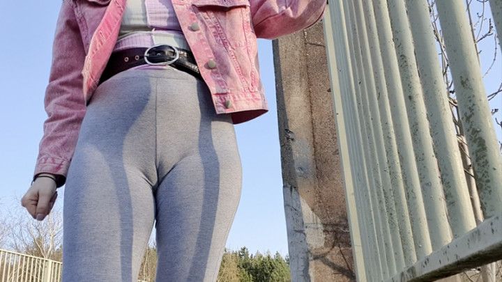 Grey leggings on the bridge wetting pee