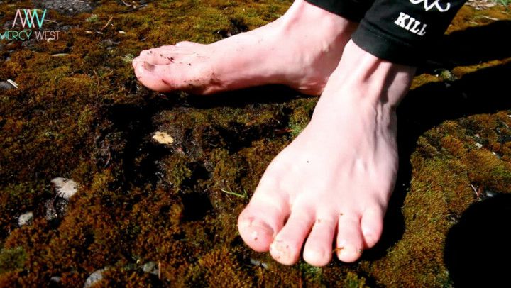 Dirty little feet in the moss