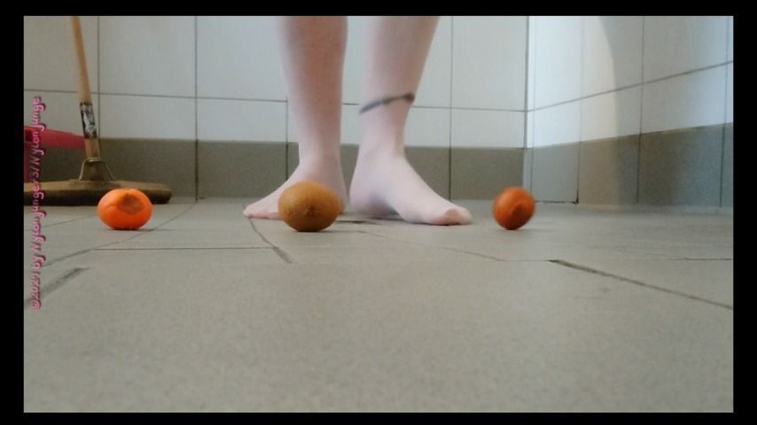 Footplay in pantyhose with fruit