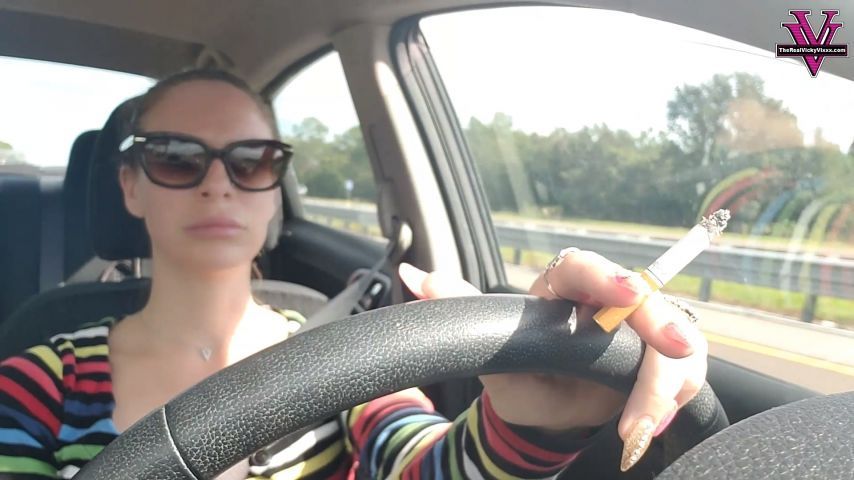 Smoking and driving in a rainbow shirt