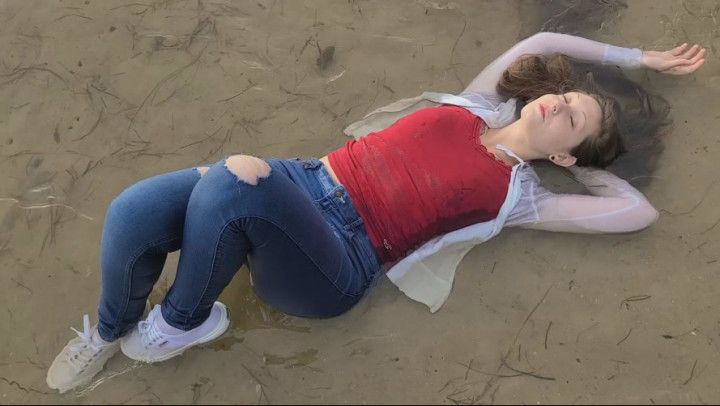 White sneakers and jeans at the beach