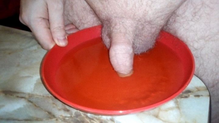 John is Peeing on a Plate with the Cock