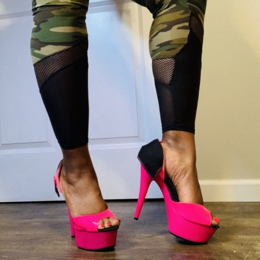 Pink heels contrasted with camo