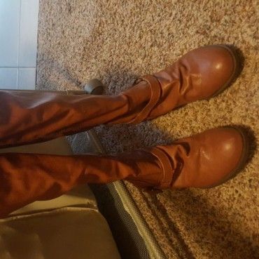 Brown tall boots with small heel