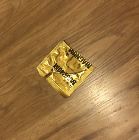 Used cum filled condom and wrapper